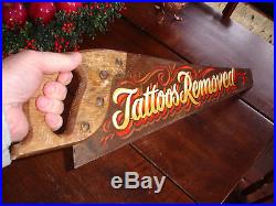 A Humorous Tattoo Studio Trade Sign, Painted On A Hand Saw, Superb Folk Art