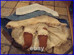 Antique cloth folk art rag doll painted face with little teeth, old bue dress