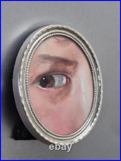 Folk art Painting of an eye in Sterling Silver frame from prominent estate