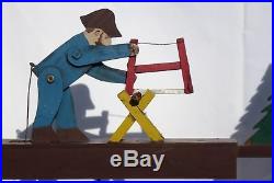 Nicely painted, contructed, old folk art whirligig of a bearded man sawing wood