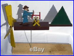 Nicely painted, contructed, old folk art whirligig of a bearded man sawing wood