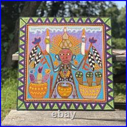 This is a traditional Huichol yarn painting from Mexico
